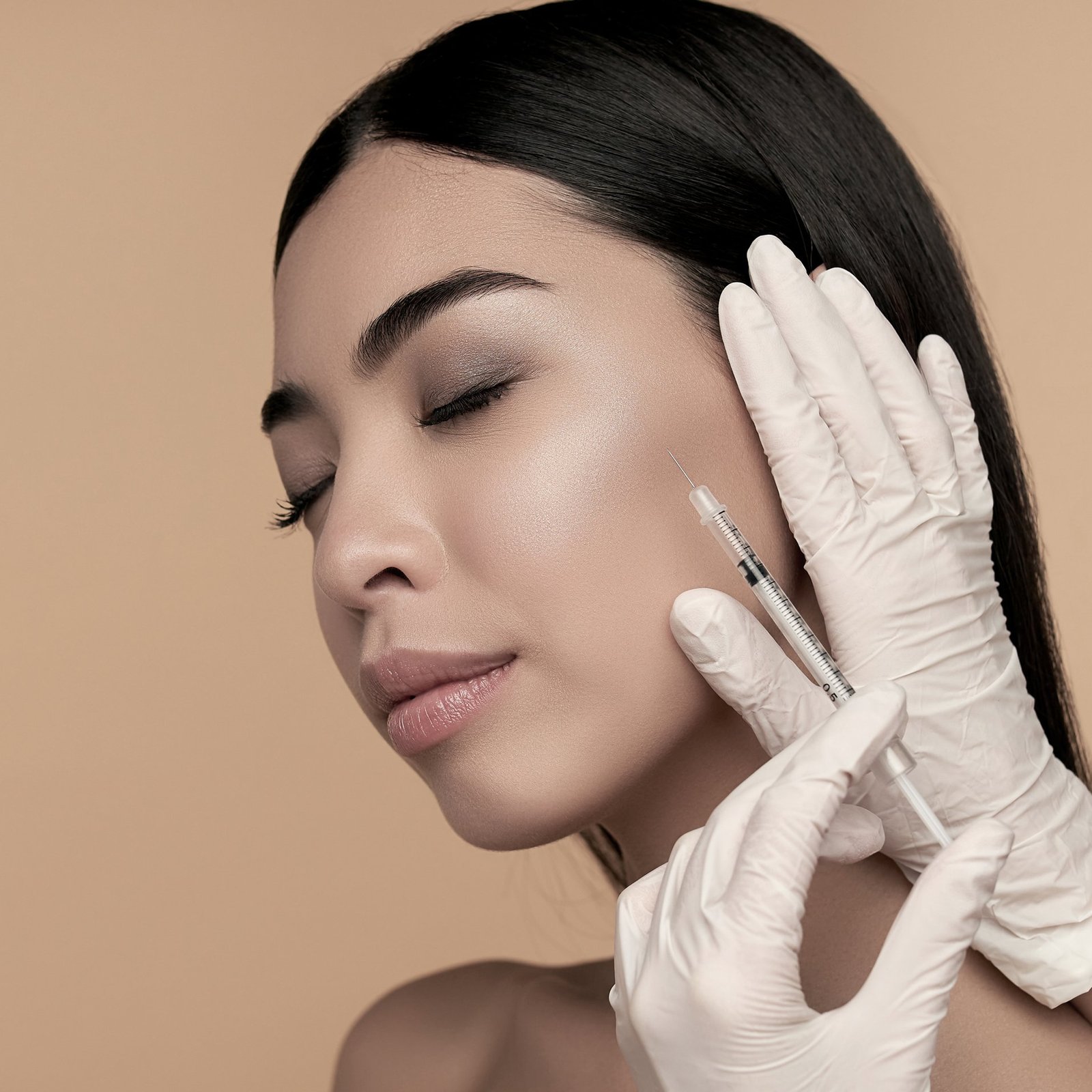 Young Asian woman with clean radiant skin gets ha dermal filler